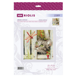 Cross-stitch of a curious tabby cat peeking through a wooden fence at a red dragonfly, with green leaves and berries in the background.