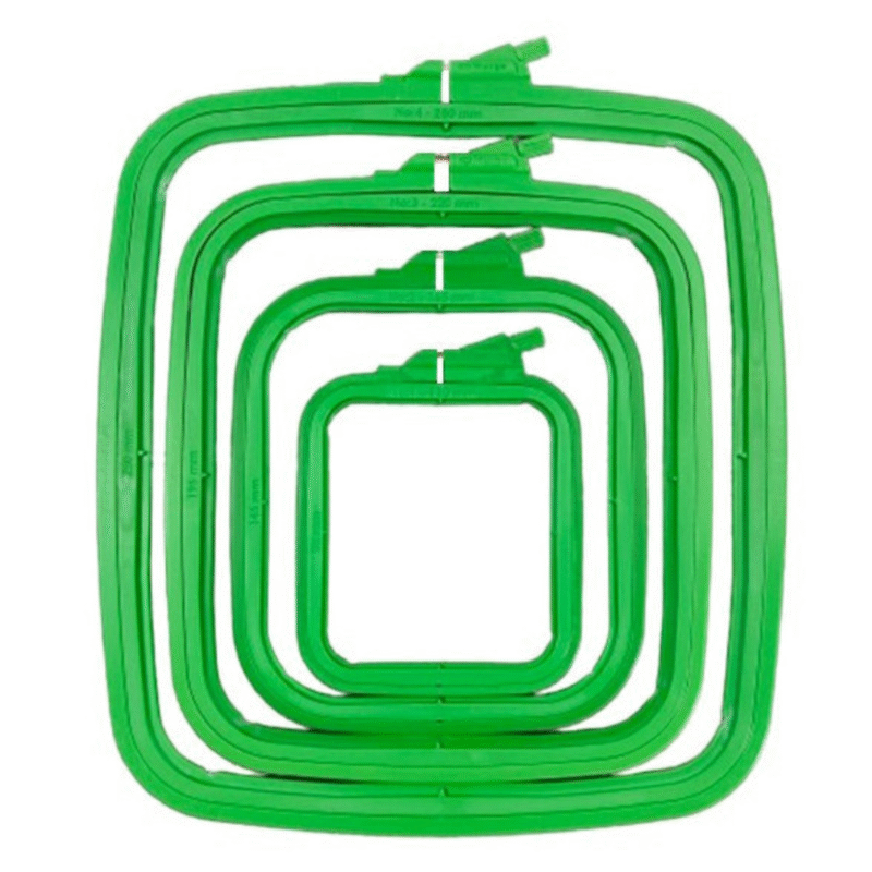Square green plastic embroidery hoops in four sizes, designed to hold and display finished cross stitch and embroidery projects.
