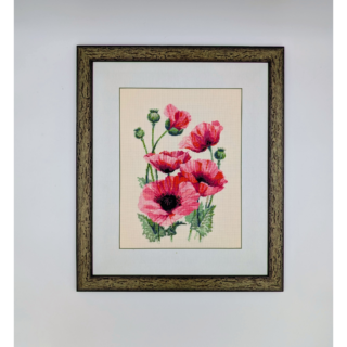 Stitched and framed embroidery artwork depicting a bouquet of pink poppies with green buds on a light background.