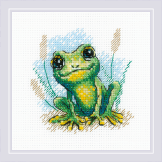 Cross-stitch design of a small green frog with bright yellow accents sitting in grass with a watercolor-style background.