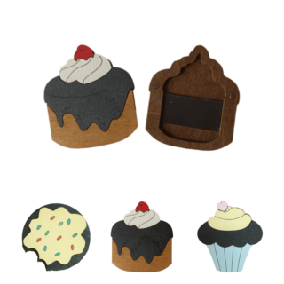 Wooden needle cases shaped like cookies and cupcakes, including a yellow sprinkle cookie, a cake with cherry, and a chocolate cupcake with heart topping.