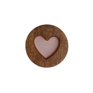 Wooden magnetic needle minder with round wooden base and pink heart center.